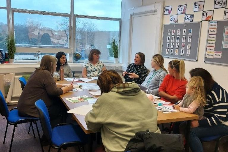 Group of people working around a table