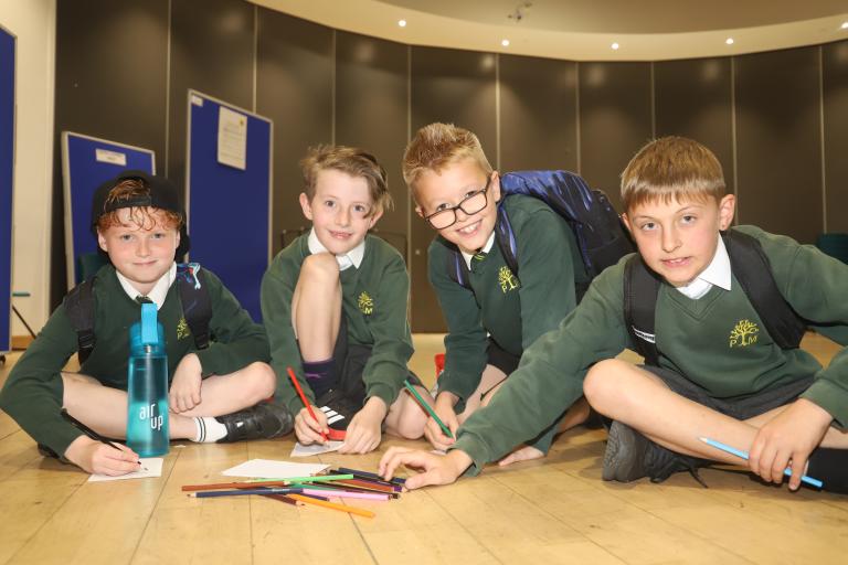 School children enjoying a colouring activity as part of a University of Essex experience day