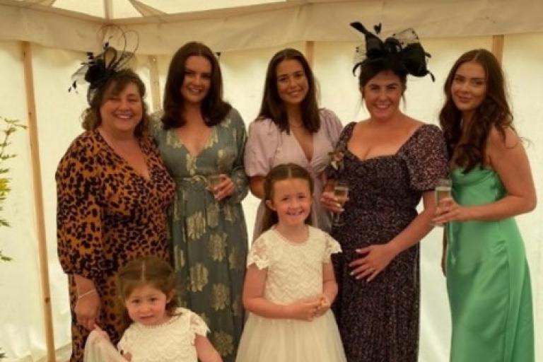 Amy and her daughters at a family wedding