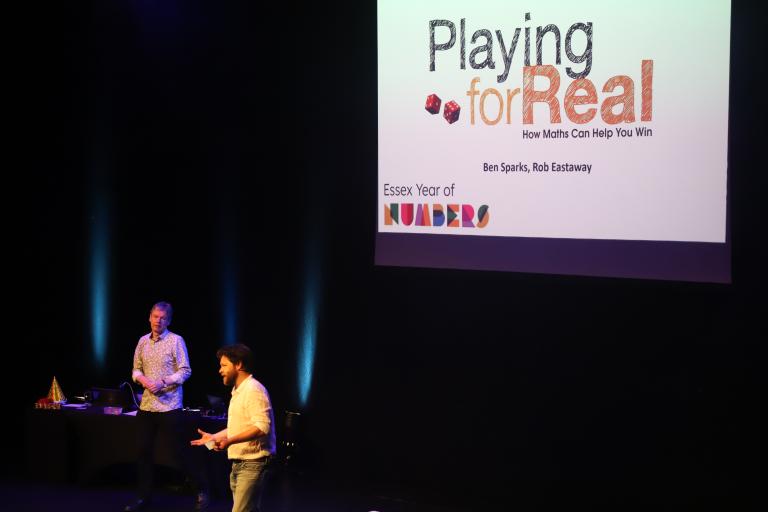 Rob Eastaway and Ben Sparks giving a fun maths lecture on stage